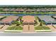Aerial view of home featuring a tile roof, two-car garage, and paver driveway at 15707 Sacile Ln, Bradenton, FL 34211