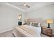 Cozy bedroom featuring soft carpeting, neutral colors, and a ceiling fan at 15707 Sacile Ln, Bradenton, FL 34211