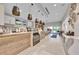 Modern cafe with wooden accents, sleek lighting, beverage service, and seating area with windows to outdoors at 15707 Sacile Ln, Bradenton, FL 34211