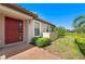 Charming front door with brick paved entry, landscaping, and manicured lawn at 15707 Sacile Ln, Bradenton, FL 34211