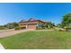A beautiful home featuring a two car garage with brick paved driveway and manicured lawn at 15707 Sacile Ln, Bradenton, FL 34211
