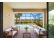 Inviting screened lanai with stylish seating, overlooking the pool and picturesque backyard at 15707 Sacile Ln, Bradenton, FL 34211