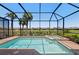 Inviting screened-in pool and spa area surrounded by lush landscaping and views of the community at 15707 Sacile Ln, Bradenton, FL 34211