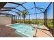 Beautiful pool and spa enclosed within a screened lanai, offering a relaxing outdoor retreat at 15707 Sacile Ln, Bradenton, FL 34211