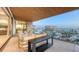 Open air balcony with elegant furniture and ocean and resort views at 1591 Gulf Of Mexico Dr # 511, Longboat Key, FL 34228