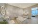 Bright bathroom with dual vanities, modern tub, and elegant finishes at 1591 Gulf Of Mexico Dr # 511, Longboat Key, FL 34228