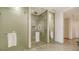 Contemporary walk-in shower with dual showerheads and frosted glass at 1591 Gulf Of Mexico Dr # 511, Longboat Key, FL 34228