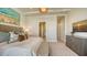 Well-appointed bedroom with an ensuite bathroom featuring a shower and a view of the rest of the house at 1591 Gulf Of Mexico Dr # 511, Longboat Key, FL 34228
