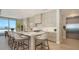 Modern kitchen with stainless steel appliances, marble countertops, and island seating at 1591 Gulf Of Mexico Dr # 511, Longboat Key, FL 34228