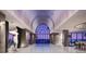 Modern lobby with an arched ceiling and glass doors showing the beach and ocean at 1591 Gulf Of Mexico Dr # 511, Longboat Key, FL 34228
