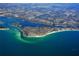 Breathtaking aerial view of a coastal community surrounded by turquoise waters and lush green landscapes at 19 Whispering Sands Dr # 805, Sarasota, FL 34242