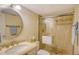 Bathroom featuring a vanity, shower with glass door, and neutral color scheme at 19 Whispering Sands Dr # 805, Sarasota, FL 34242