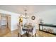 Dining room with seating for four, accented by modern lighting and travertine floors at 19 Whispering Sands Dr # 805, Sarasota, FL 34242