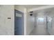 Condo hallway leading to unit 805 with textured walls and tile flooring overlooking water views at 19 Whispering Sands Dr # 805, Sarasota, FL 34242