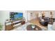 Relaxing open-concept living area and dining room bathed in sunlight at 19 Whispering Sands Dr # 805, Sarasota, FL 34242