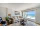 Living room offering comfortable seating and an amazing view of the ocean and sandy beach at 19 Whispering Sands Dr # 805, Sarasota, FL 34242