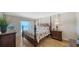 Main bedroom with a four poster bed and direct access to the beach at 19 Whispering Sands Dr # 805, Sarasota, FL 34242