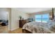 Warm and inviting primary bedroom offers a serene retreat with views of the beach at 19 Whispering Sands Dr # 805, Sarasota, FL 34242