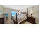Bright main bedroom with beach views and elegant furniture at 19 Whispering Sands Dr # 805, Sarasota, FL 34242