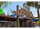 A fun restaurant sign with a marlin on top of the wood sign and a fun beach vibe at 19 Whispering Sands Dr # 805, Sarasota, FL 34242