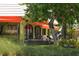 Exterior view of the Village Cafe with outdoor seating at 19 Whispering Sands Dr # 805, Sarasota, FL 34242