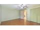 Well-lit bedroom with hardwood floors and access to an en-suite bathroom at 2061 Misty Sunrise Trl, Sarasota, FL 34240