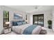 Serene bedroom with a view of the pool, complemented by a contemporary design and ample natural light at 2061 Misty Sunrise Trl, Sarasota, FL 34240