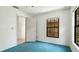 Cozy bedroom with a view and an entrance to another room at 2061 Misty Sunrise Trl, Sarasota, FL 34240