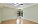 Light-filled bedroom with hardwood floors and large windows at 2061 Misty Sunrise Trl, Sarasota, FL 34240