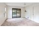 Spacious bedroom with sliding glass doors leading to the pool area at 2061 Misty Sunrise Trl, Sarasota, FL 34240