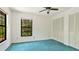 Bedroom with a window view of lush greenery and ample closet space at 2061 Misty Sunrise Trl, Sarasota, FL 34240