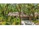 Charming single-story home with a two-car garage and lush landscaping at 2061 Misty Sunrise Trl, Sarasota, FL 34240