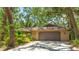 Single-story house featuring a two-car garage and attractive siding at 2061 Misty Sunrise Trl, Sarasota, FL 34240