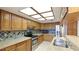 Bright kitchen with granite countertops, stainless steel appliances, and a unique tile backsplash at 2061 Misty Sunrise Trl, Sarasota, FL 34240