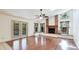 Bright living room with access to a pool area through glass doors at 2061 Misty Sunrise Trl, Sarasota, FL 34240