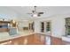 Open floor plan with hardwood floors connects to the kitchen area at 2061 Misty Sunrise Trl, Sarasota, FL 34240