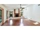 Spacious living room featuring hardwood floors and a brick fireplace at 2061 Misty Sunrise Trl, Sarasota, FL 34240