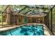 Enjoy poolside relaxation with a screened-in pool, patio, and access to the home at 2061 Misty Sunrise Trl, Sarasota, FL 34240