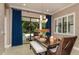 Bright dining room with patio views, modern lighting, and stylish decor at 21225 Wacissa Dr, Venice, FL 34293