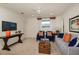 Bright living room featuring comfortable seating, stylish decor, and ample natural light at 21225 Wacissa Dr, Venice, FL 34293
