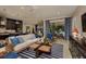 Comfortable living room featuring stylish furniture, a textured wall, and patio access at 21225 Wacissa Dr, Venice, FL 34293
