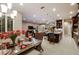 An open-concept dining area connects to a cozy living room and a stylish kitchen, creating an inviting atmosphere at 21225 Wacissa Dr, Venice, FL 34293