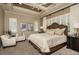 Serene main bedroom with tray ceiling, plantation shutters, and decorative accents at 21225 Wacissa Dr, Venice, FL 34293