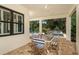 Relaxing covered patio offering outdoor dining and pool views at 21225 Wacissa Dr, Venice, FL 34293