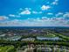 Expansive aerial view of the community, highlighting numerous lakes, green spaces, and the home's location at 230 Fareham Dr, Venice, FL 34293