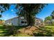 Back of the home with a spacious screened-in patio, perfect for outdoor relaxation at 230 Fareham Dr, Venice, FL 34293