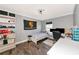 This bedroom features wood-look floors and a large window for natural light at 230 Fareham Dr, Venice, FL 34293