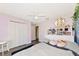 Bright bedroom featuring wood-look floors, ceiling fan and closet with double doors at 230 Fareham Dr, Venice, FL 34293