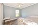 Bedroom features wood-look floors and lots of natural light at 230 Fareham Dr, Venice, FL 34293