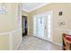 Bright and spacious foyer featuring tiled floors and classic white trim at 230 Fareham Dr, Venice, FL 34293